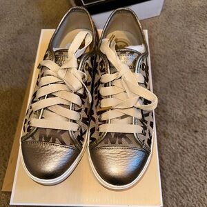 Micheal Kors gold sneakers gently used woman’s 7.5